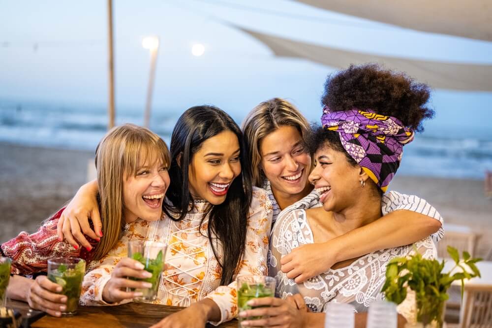 Photo of four people enjoying drinks in downtown Aruba